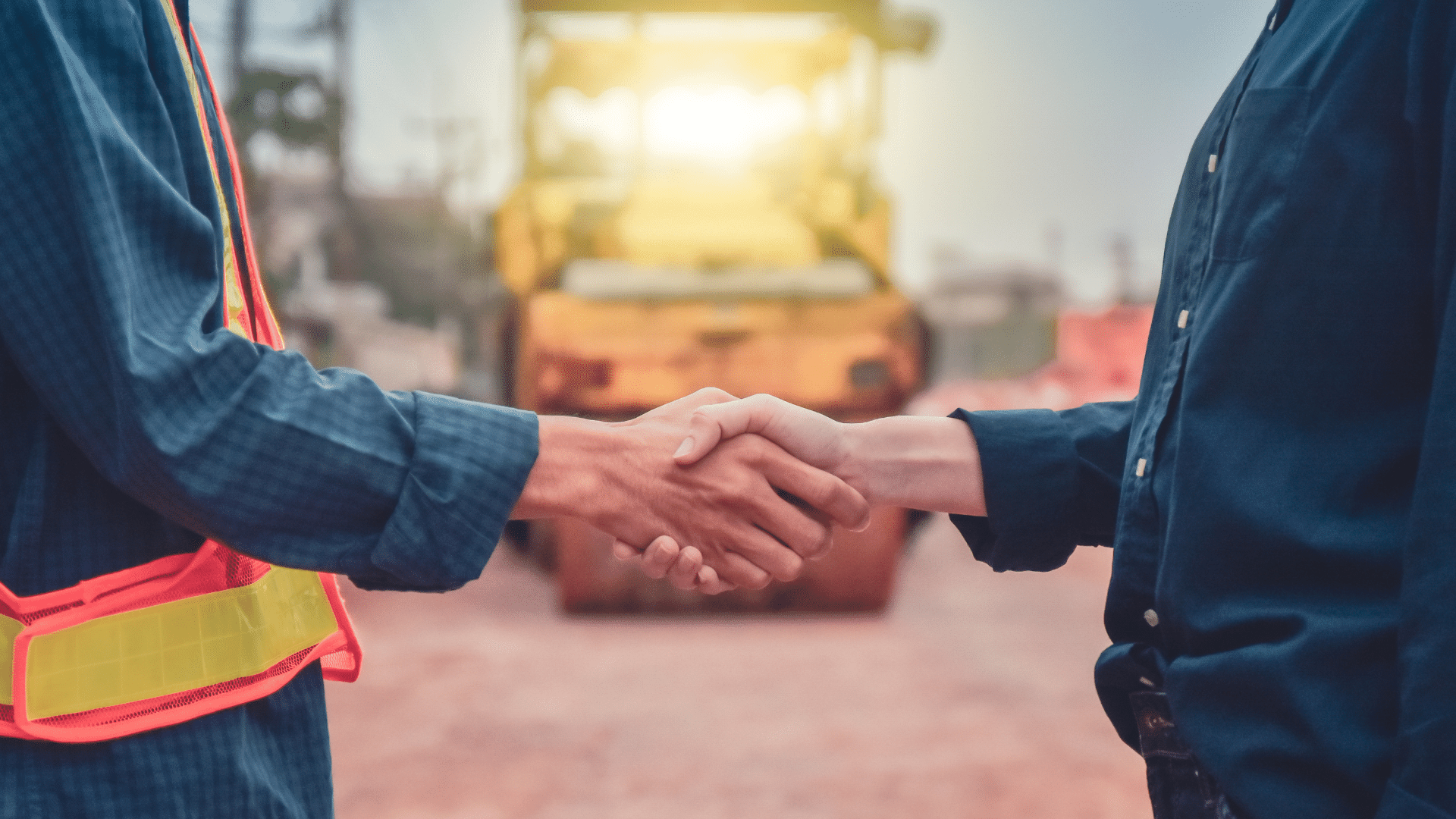 Workers shaking hands on an enterprise agreement